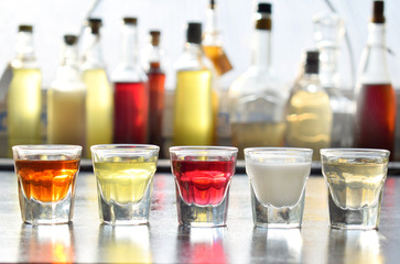 Selection of alcoholic drinks. Set of wine, brandy, liqueur, tincture, cognac, whiskey in glasses, bottles. Large variety of alcohol and spirits for making cocktails and drink. Copy space for text