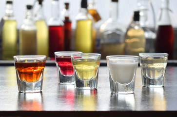Selection of alcoholic drinks. Set of wine, brandy, liqueur, tincture, cognac, whiskey in glasses, bottles. Large variety of alcohol and spirits for making cocktails and drink. Copy space for text