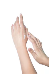 Poster woman isolated on white studio shot applying cream on her hands © ookawaphoto