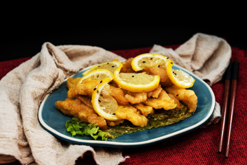 Chinese food fried fish and lemon slices