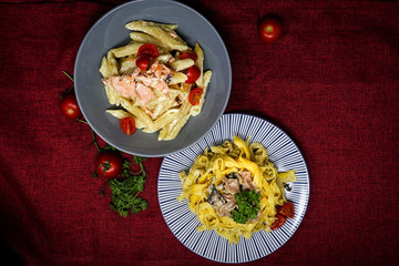 Pasta with pesto sauce and nuts on a the table