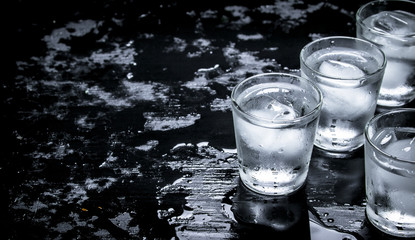 Vodka shots with ice.