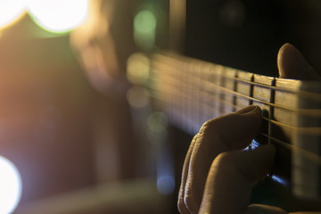 Fototapeta premium Playing the guitar, close up