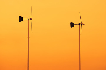 Fototapeta na wymiar Wind turbine in sunset background.Thailand.