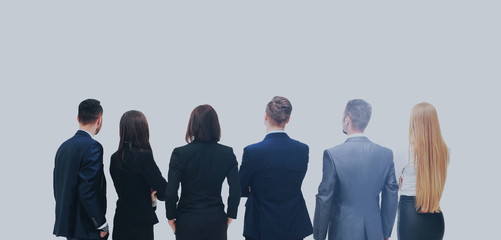 Obraz premium Successful business team looking upwards standing back side