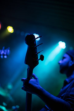 Guitarist playing on electric guitar.