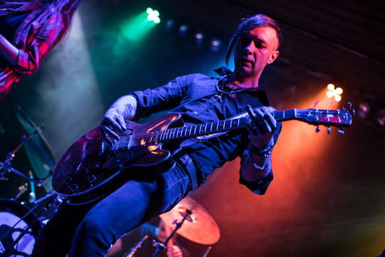 Guitarist playing on electric guitar.