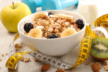 bowl of cereal, fruit and dumbbell