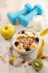 bowl of cereal, fruit and dumbbell