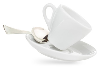 porcelain coffee cup on saucer with spoon isolated on white