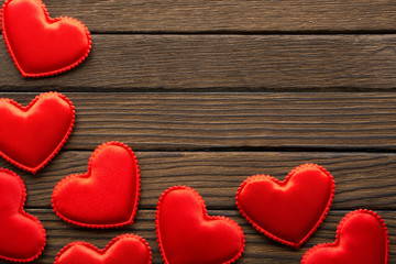 Red hearts on wooden table with copy space