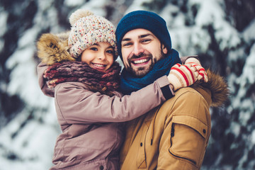 Dad with daughter outdoor in winter