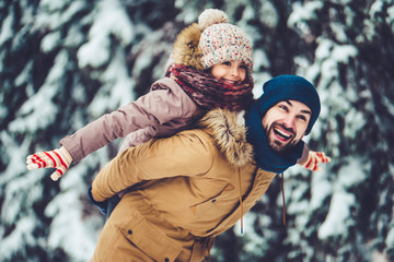 Dad with daughter outdoor in winter