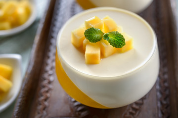 Panna cotta dessert  on a wooden board 