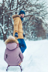 Fototapeta na wymiar Dad with daughter outdoor in winter