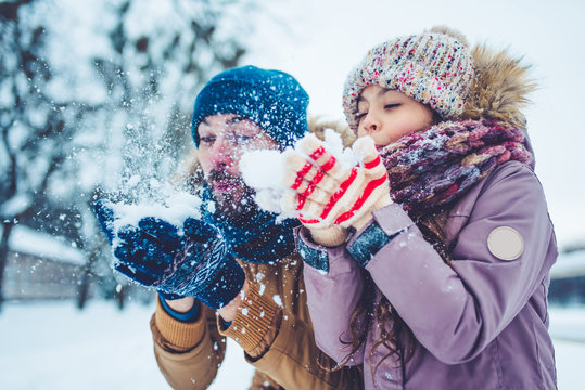 Dad With Daughter Outdoor In Winter