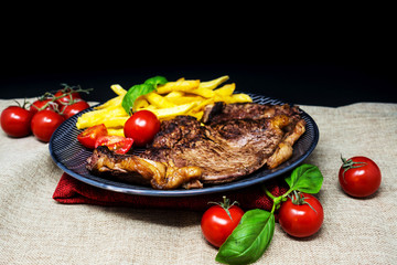 juicy steak beef meat with tomato and french fries