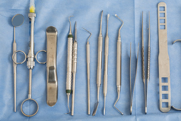 top view of dental mirror and professional dental instruments