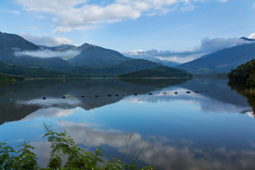 Lake with surrounded by mountains.