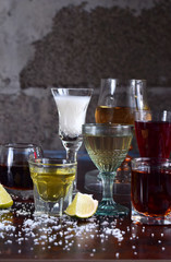 Selection of alcoholic drinks. Set of wine, brandy, liqueur, tincture, cognac, whiskey in glasses. Large variety of alcohol and spirits for making cocktails and drink. Copy space for text
