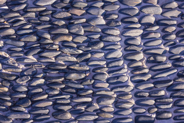 Fototapeta na wymiar A texture of gray pebbles.