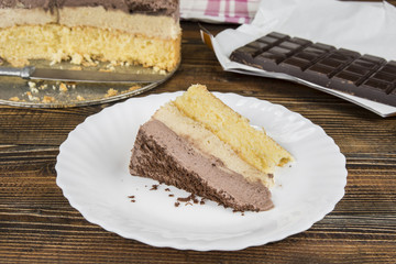 Homemade cheesecake with chocolate on wooden table