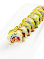 Green dragon sushi roll with avocado, eel and tobiko