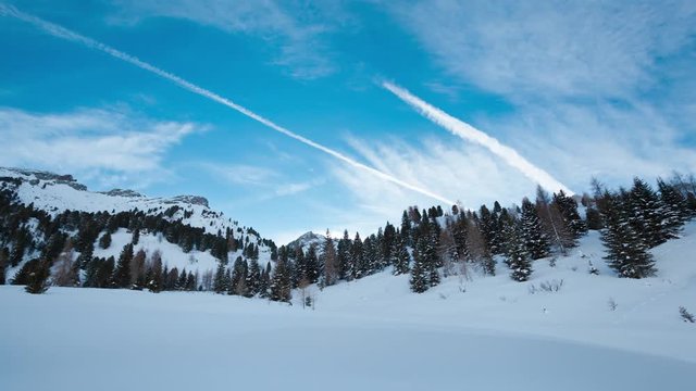 Time lapse mountain landscape with snow during sunny day