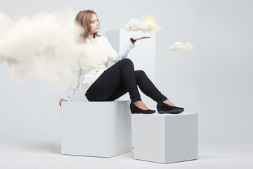 Woman with cloud and sun. Concept on the topic of computer cloud services.