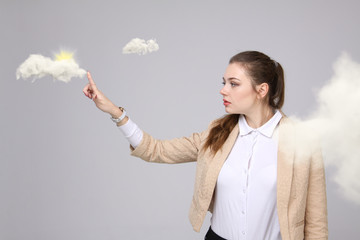 Woman with cloud and sun. Concept on the topic of computer cloud services.