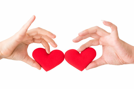 Red heart on couple hands isolated