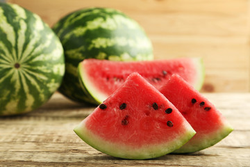 Slices of watermelons on brown wooden table