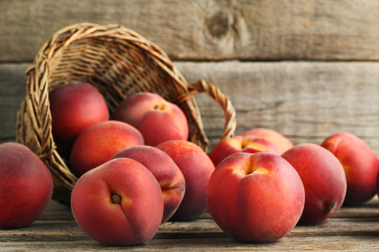 Sweet nectarines fruit on grey wooden table