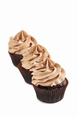 Tasty cupcakes isolated on a white