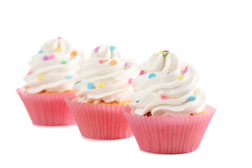 Tasty cupcakes isolated on a white