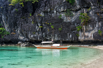 Fototapeta na wymiar Small bangka boat on the bay of El Nido, Philippines
