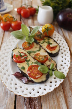 Baked eggplants stuffed with vegetable and cheese