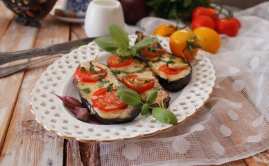 Baked eggplants stuffed with vegetable and cheese