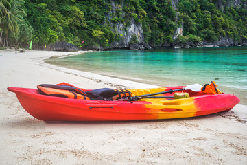 Fototapeta na wymiar Kayak on the beautiful idyllic beach
