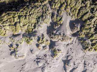 Looking down on coastal sand dunes. Aerial image. A view straight down on the sand dune and vegetation around Porthmadog beach, Wales, UK. Taken from the air but a drone.