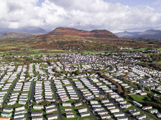 Fototapeta premium Caravan and camping, static home aerial view. Porthmadog holiday park taken from the air by a drone
