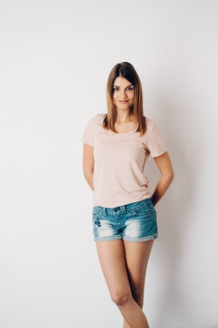 Portrait of a fit young woman wearing short jeans
