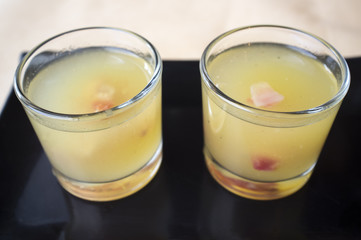 Small shots of melon  with cured ham