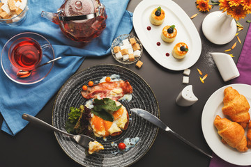 Restaurant breakfast with bacon and fried eggs