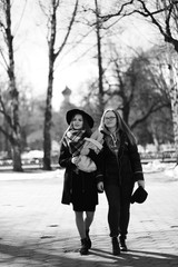 Fototapeta premium Black and white photo of a young girl on a walk