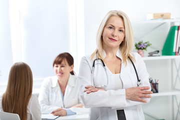 Doctor with stethoscope. Healthcare and medical concept - doctor with patient in hospital
