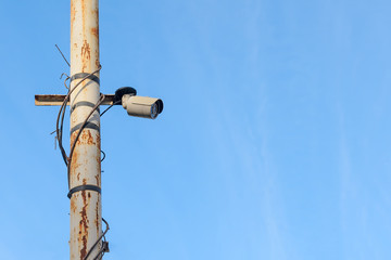 Fototapeta premium security surveillance camera on the pole