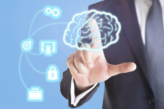Close up of businessman holding digital image of brain in palm with business icon