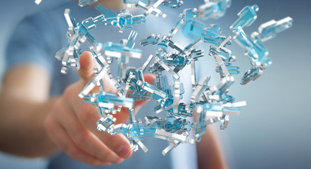 Businessman holding 3D rendering group of blue people