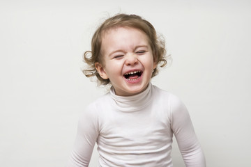 Beautiful expressive happy cute laughing smiling baby infant face